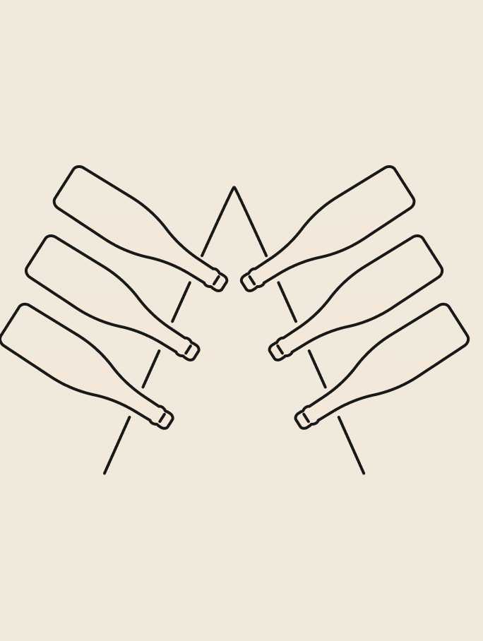 Six CHANDON sparkling wine bottles in a pyramid shape, undergoing second fermentation.
