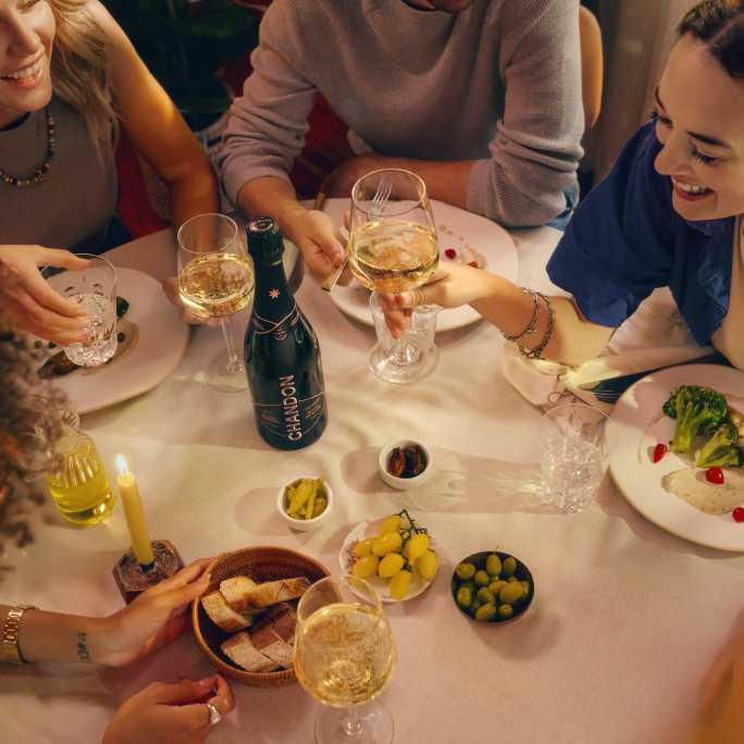 People dinning with a CHANDON Vintage bottle