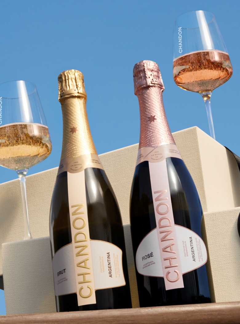 CHANDON Argentina Brut and Rosé sparkling wine bottles with glasses in a luxury gift box against a blue sky