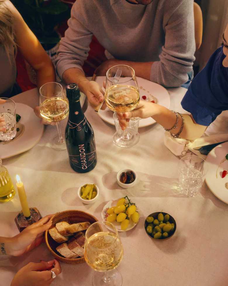 People dinning with a CHANDON Vintage bottle